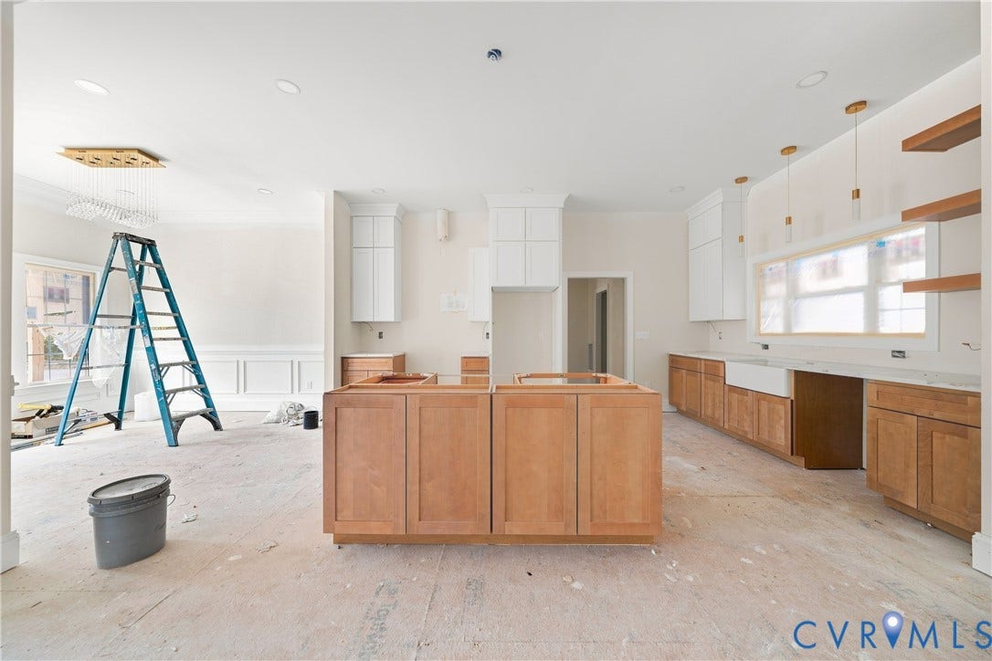 13216 Bradley Bridge Road, Chester, VA 23831 Kitchen featuring a double island, white shaker upper cabinetry, natural wood-finish lower cabinetry, and a white farmhouse sink