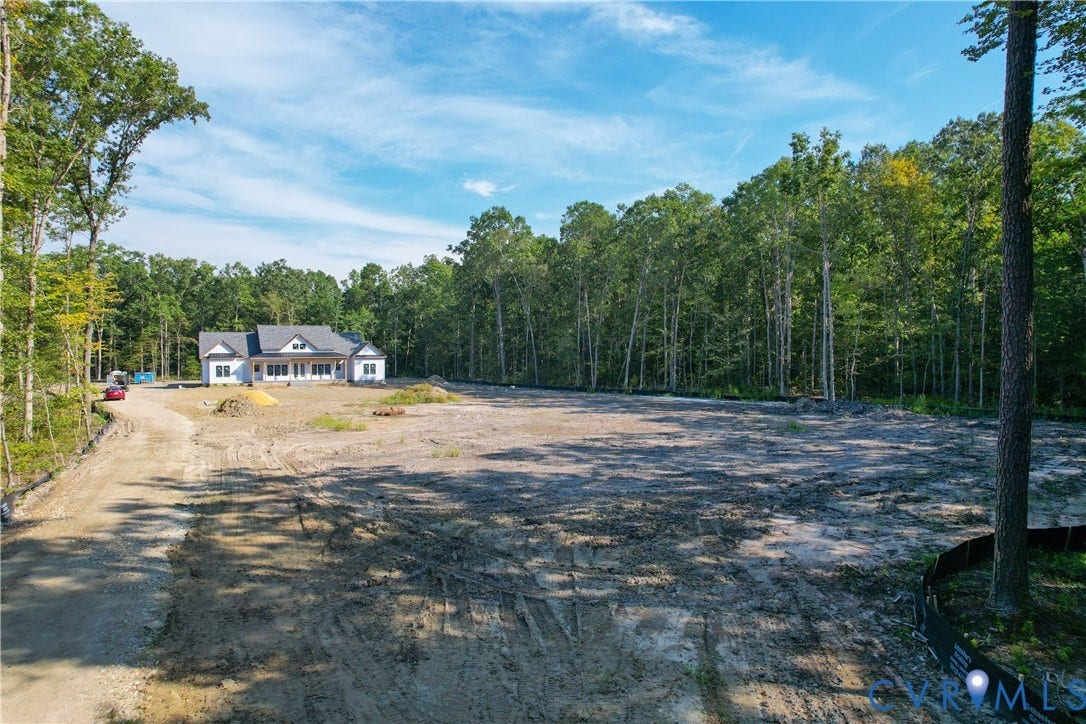 13216 Bradley Bridge Road, Chester, VA 23831 New construction home featuring a white exterior, dark gray roof, and prominent dormer windows