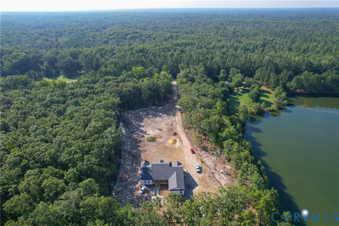 13216 Bradley Bridge Road, Chester, VA 23831 Newly constructed single-story residence with a dark shingle roof and light siding