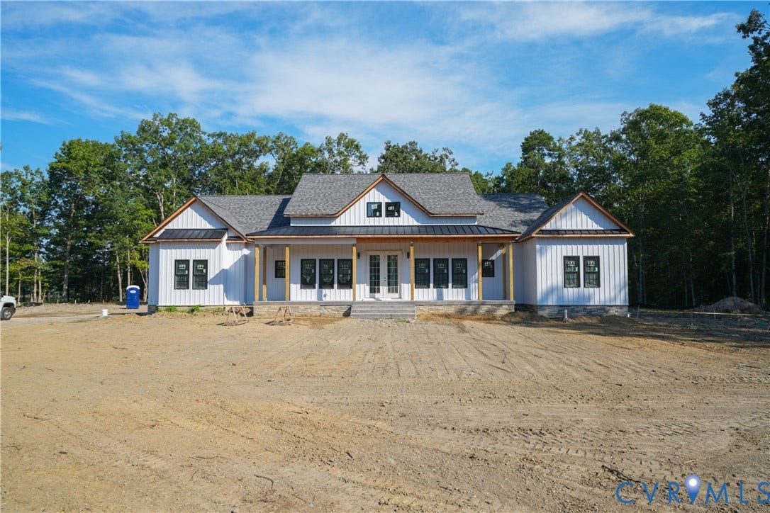 13216 Bradley Bridge Road, Chester, VA 23831 White board and batten siding with dark-framed windows
