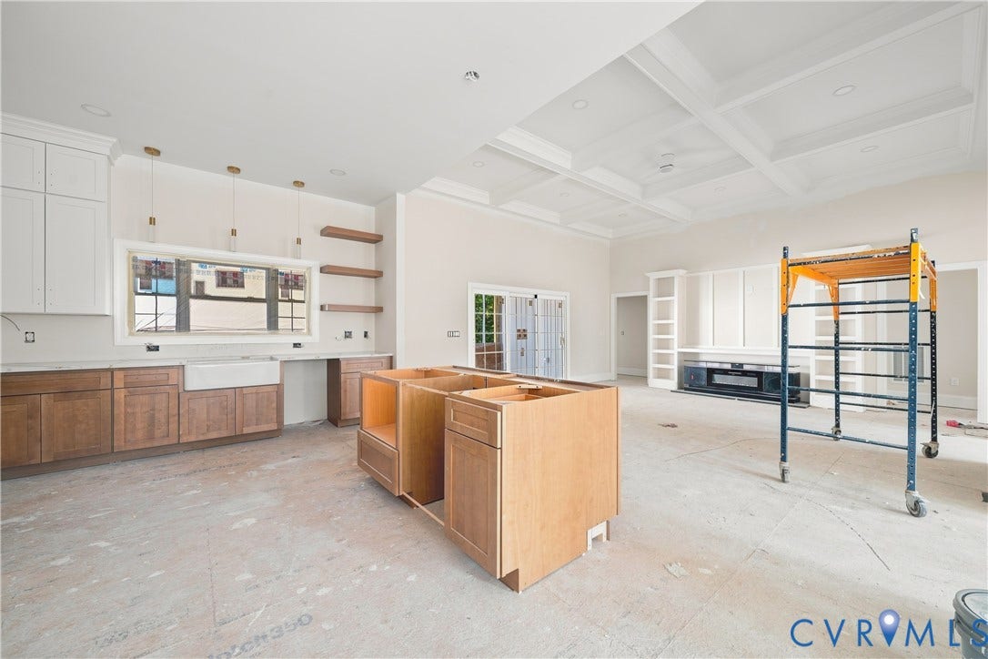 13216 Bradley Bridge Road, Chester, VA 23831 Spacious kitchen area featuring an apron-front sink, open shelving, and pendant lighting