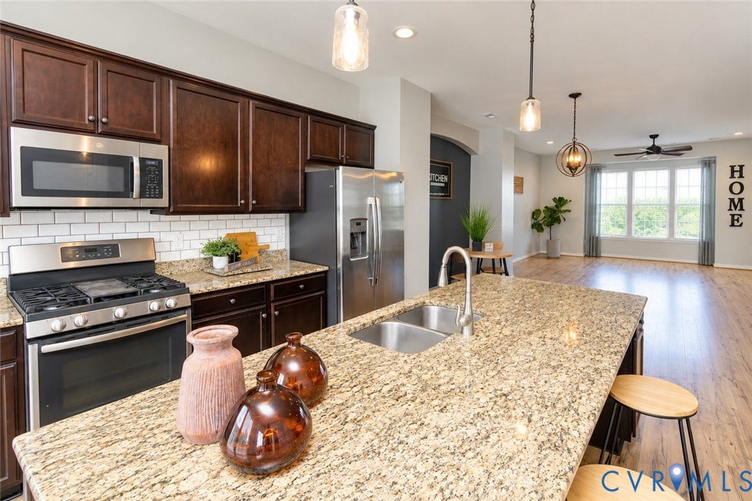 Kitchen island with granite countertop and dual basin sink