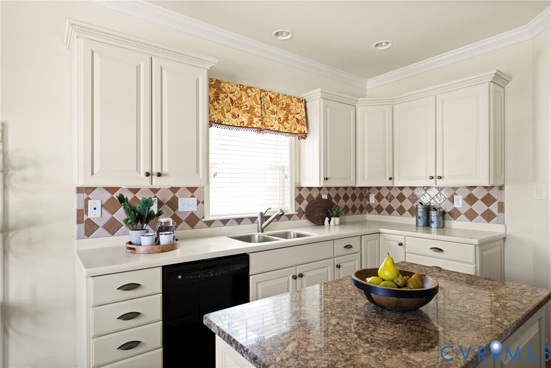 14119 Shawhan Place, Charter Colony, Midlothian, VA 23114 Kitchen featuring light-toned cabinetry, light countertops, a patterned tile backsplash, and a central island with a contrasting countertop