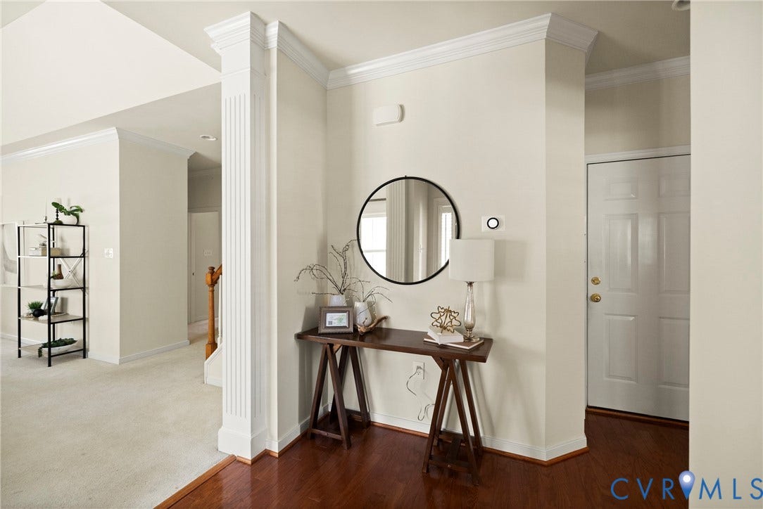 14119 Shawhan Place, Charter Colony, Midlothian, VA 23114 Fluted architectural column, crown molding, wood-finish flooring, paneled entry door, and light neutral wall tones