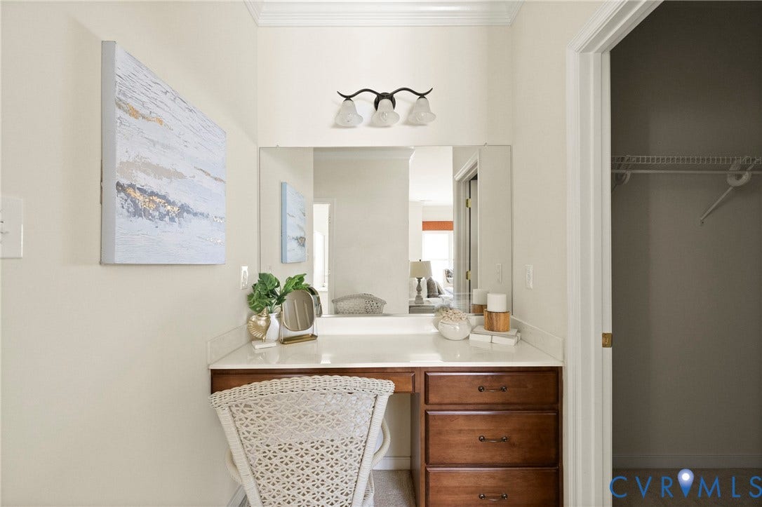 14119 Shawhan Place, Charter Colony, Midlothian, VA 23114 Built-in vanity with wood-finish cabinetry, a light-toned countertop, and an integrated mirror