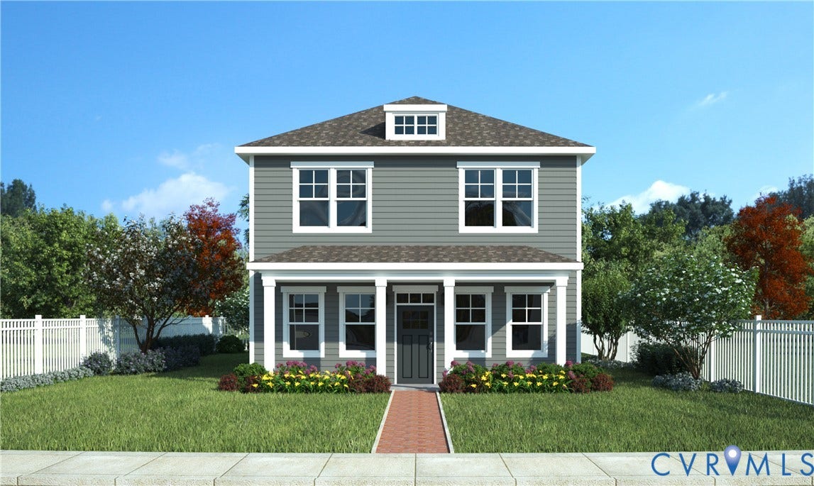 Two-story residence featuring grey siding, white trim, a covered front porch with columns, a prominent dormer, and a brick paver walkway