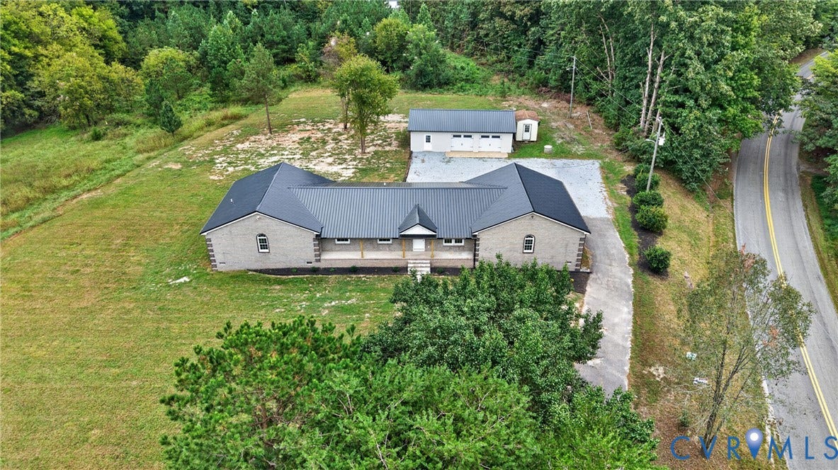 7621 Amelia Springs Road, Amelia, VA 23083 Single-story residence featuring a gray brick exterior and a dark metal roof