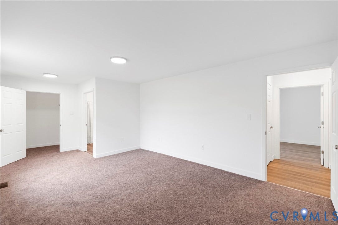 7621 Amelia Springs Road, Amelia, VA 23083 White walls, recessed ceiling lights, brown carpeting, white trim, and a wood-finish floor entryway