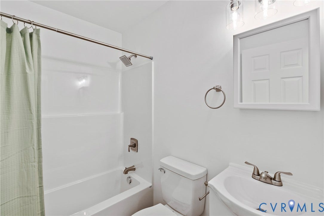 7621 Amelia Springs Road, Amelia, VA 23083 White wall-mounted sink with brushed nickel faucet