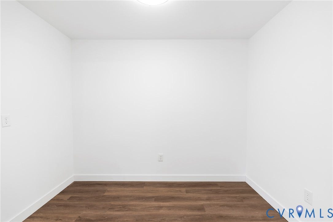 7621 Amelia Springs Road, Amelia, VA 23083 Wood-finish flooring with crisp white walls and white trim
