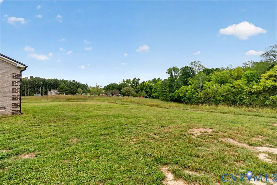 7621 Amelia Springs Road, Amelia, VA 23083 Expansive green space with mature trees bordering the property