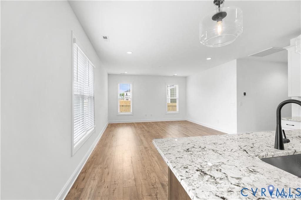 View from kitchen to bright, airy family room