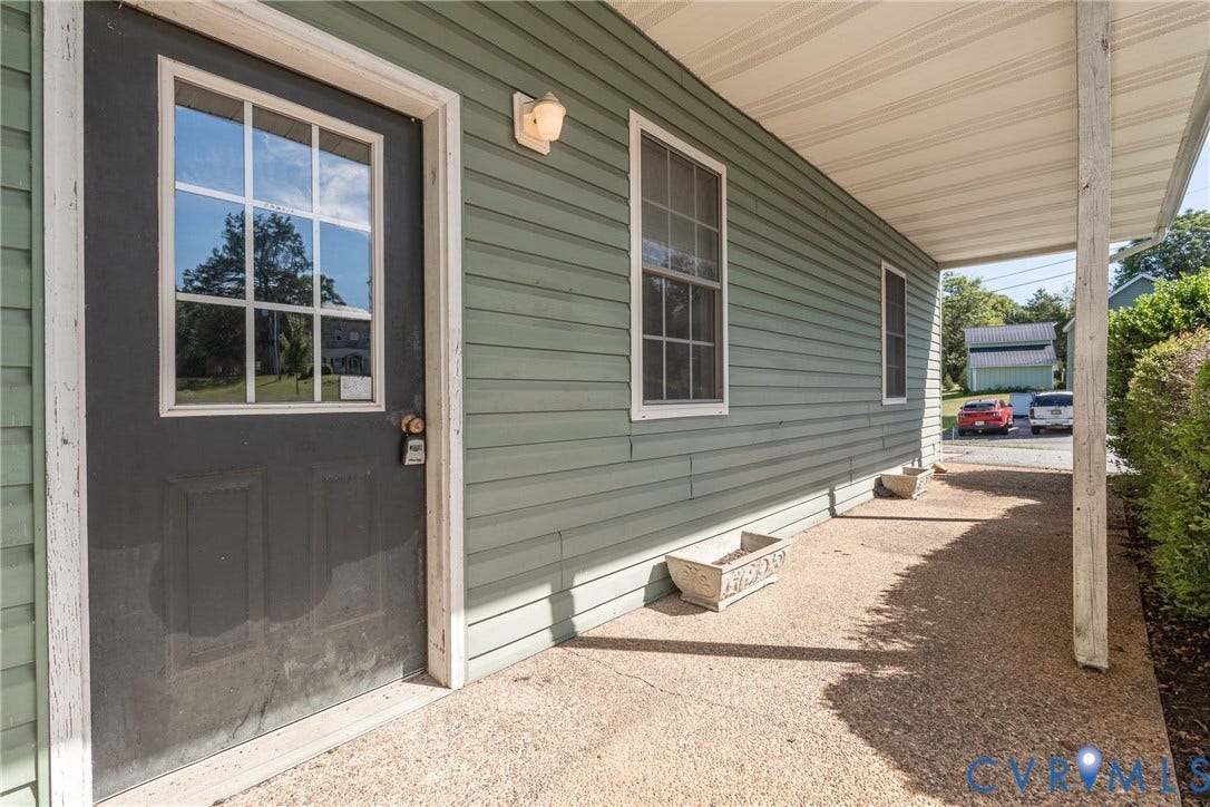 13085 W James Anderson Highway, Buckingham, VA 23921 Covered porch with exposed aggregate concrete flooring