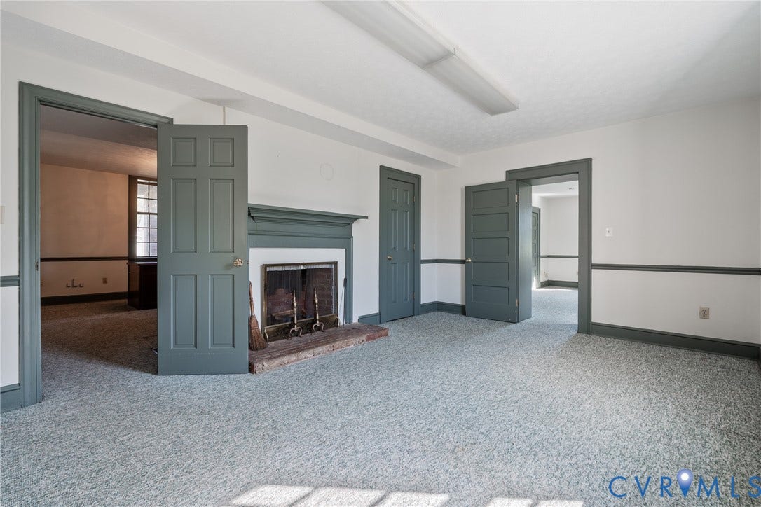 13085 W James Anderson Highway, Buckingham, VA 23921 Fireplace with a brick hearth and a painted wood mantel