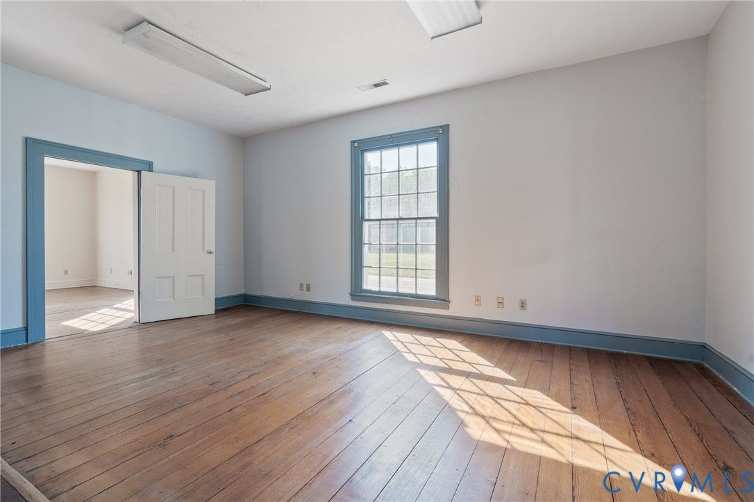 13085 W James Anderson Highway, Buckingham, VA 23921 Hardwood flooring, painted window trim, painted door trim, white paneled door, and recessed lighting