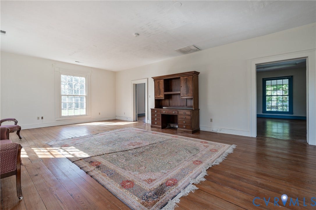 13085 W James Anderson Highway, Buckingham, VA 23921 Hardwood flooring throughout, multiple windows, and a wide doorway