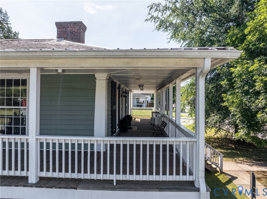 13085 W James Anderson Highway, Buckingham, VA 23921 Expansive covered porch with white railing