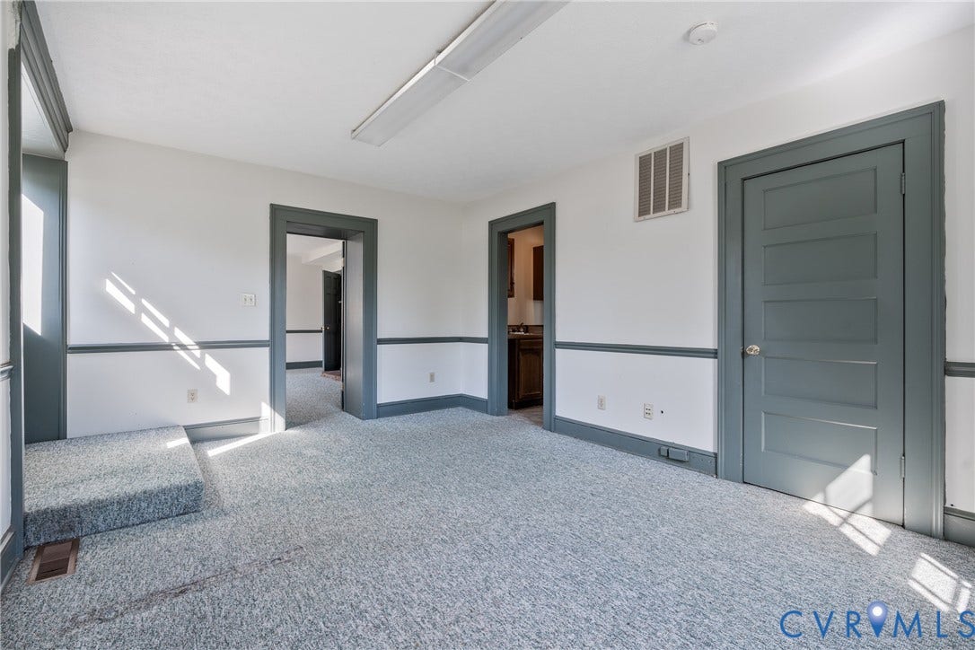 13085 W James Anderson Highway, Buckingham, VA 23921 White walls with chair rail and dark trim detail