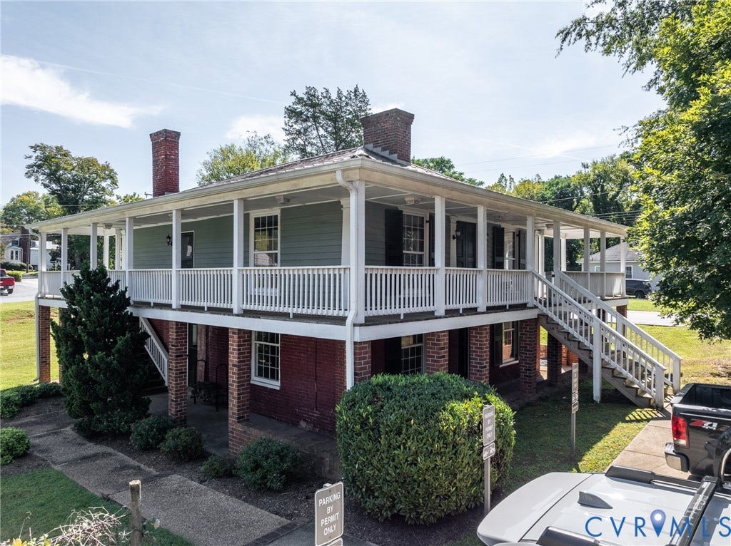 13085 W James Anderson Highway, Buckingham, VA 23921 Two-story structure featuring a brick ground level and a siding upper level