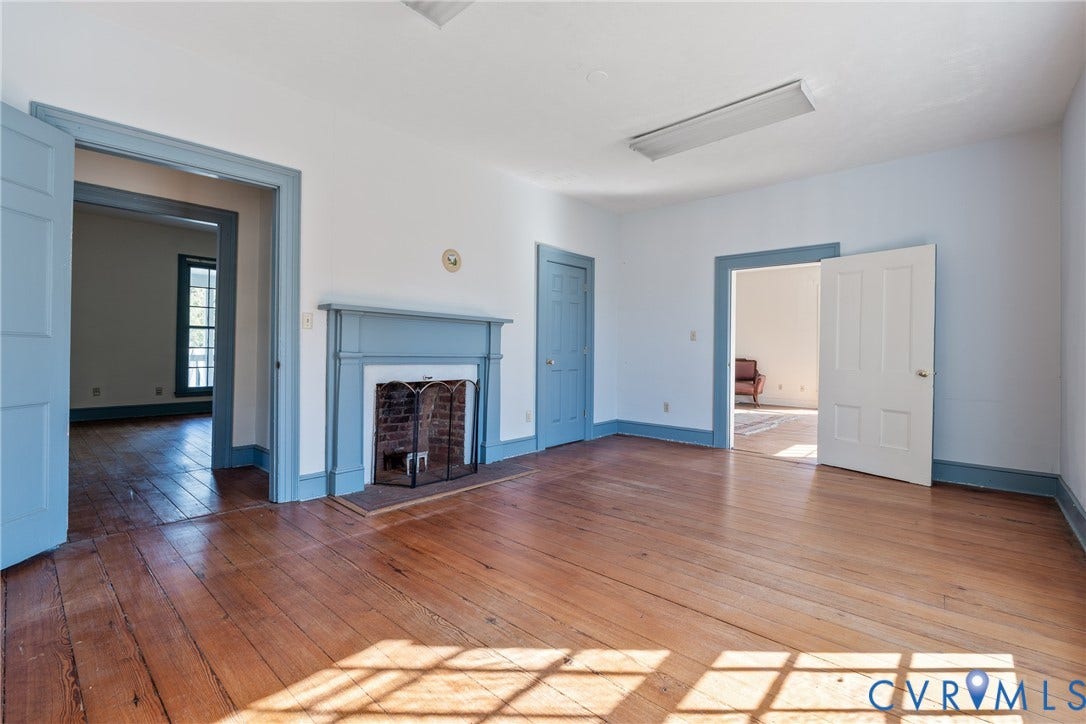 13085 W James Anderson Highway, Buckingham, VA 23921 Hardwood flooring, painted fireplace with brick firebox, painted trim, painted doors, and recessed lighting
