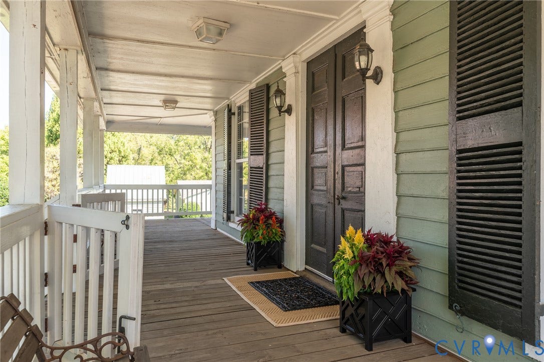 13085 W James Anderson Highway, Buckingham, VA 23921 Expansive covered porch with wood flooring and white railing