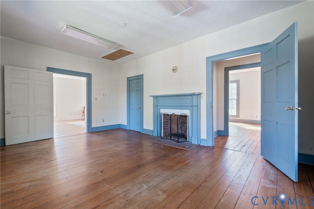 13085 W James Anderson Highway, Buckingham, VA 23921 Hardwood flooring, painted fireplace mantel, painted interior doors, and painted door trim