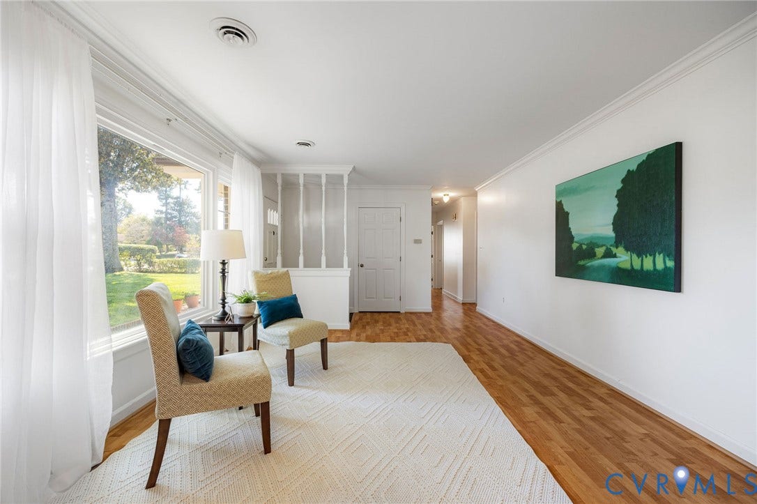 3356 Seaton Road, Petersburg, VA 23805 Bright interior with wood-finish flooring, white walls, and a large picture window