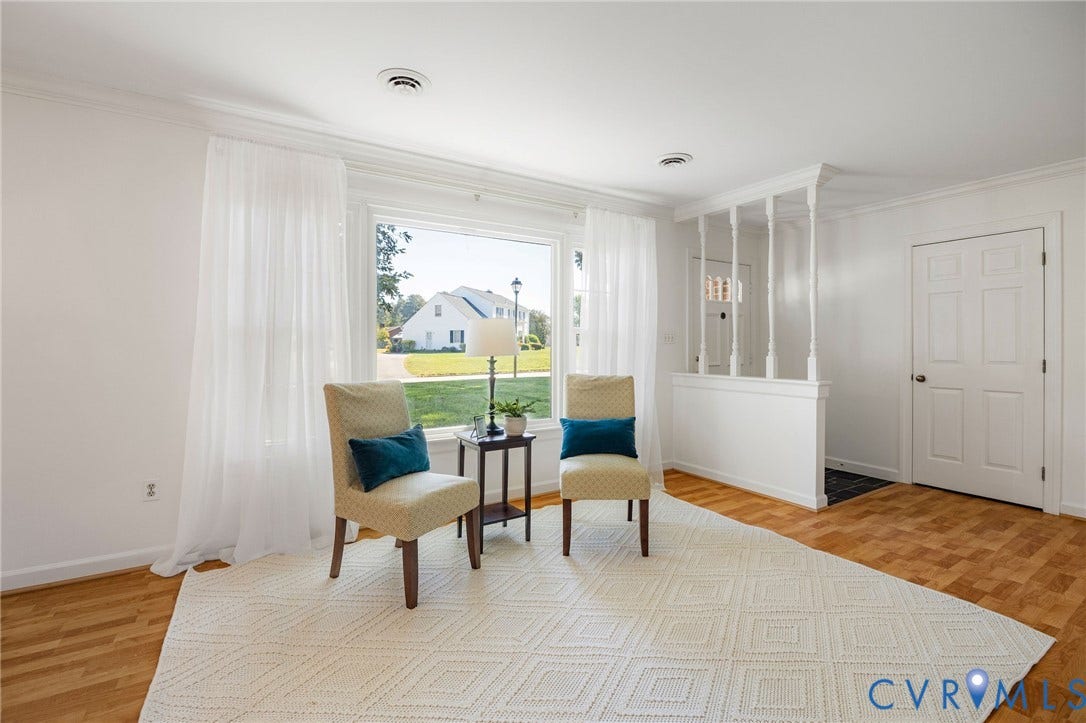 3356 Seaton Road, Petersburg, VA 23805 Hardwood flooring, crown molding, large window, paneled interior door, half wall with decorative spindles