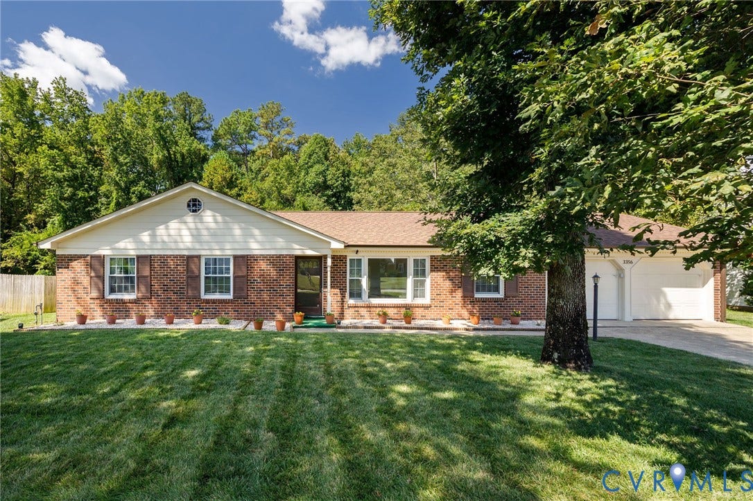 3356 Seaton Road, Petersburg, VA 23805 Brick veneer exterior with brown shutters, a gabled roofline, and an attached two-car garage