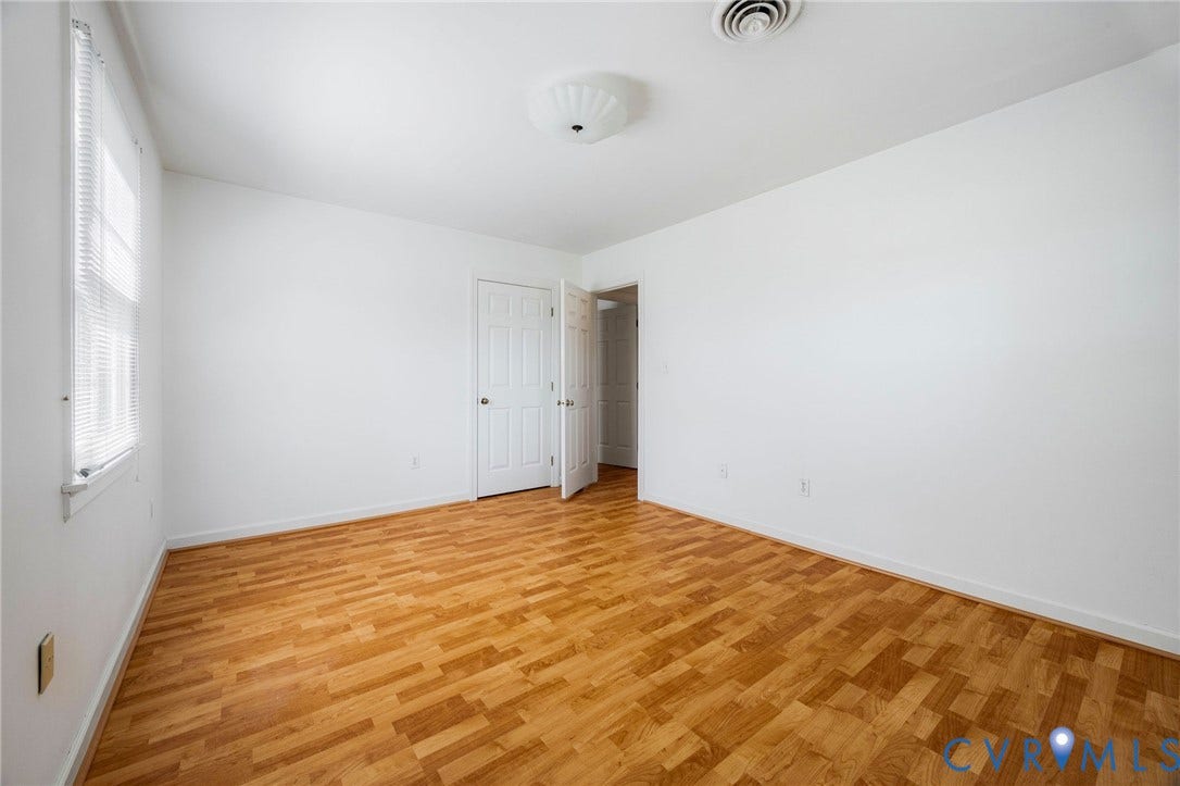3356 Seaton Road, Petersburg, VA 23805 Bedroom 2: Wood-finish flooring, 2 windows. ceiling-mounted light fixture and closet.