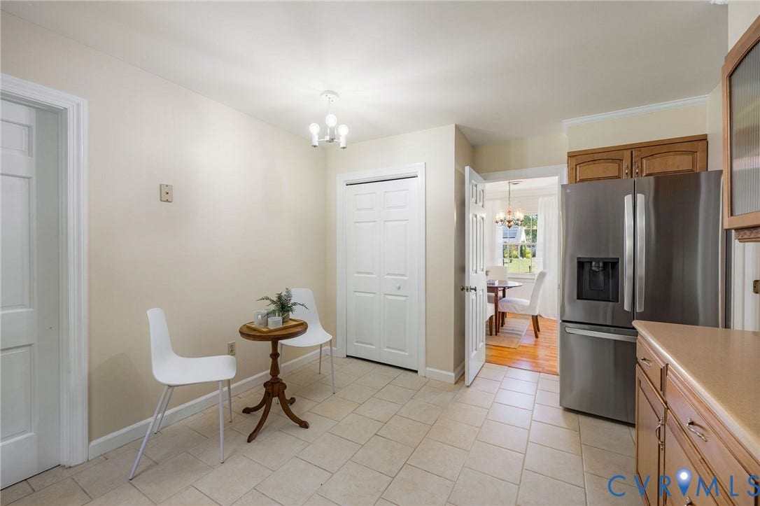 3356 Seaton Road, Petersburg, VA 23805 Kitchen featuring tile flooring, stainless steel refrigerator, wood cabinetry, and pantry.