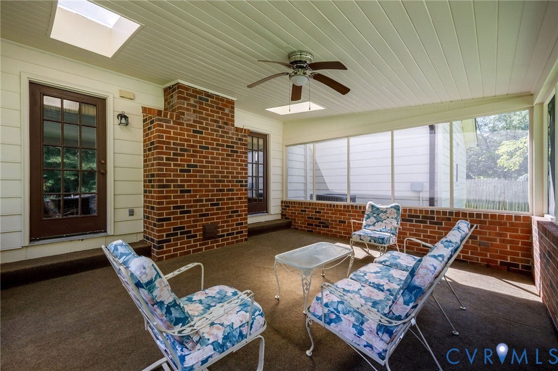 3356 Seaton Road, Petersburg, VA 23805 Screened porch featuring a brick wall accent, two skylights, and a ceiling fan