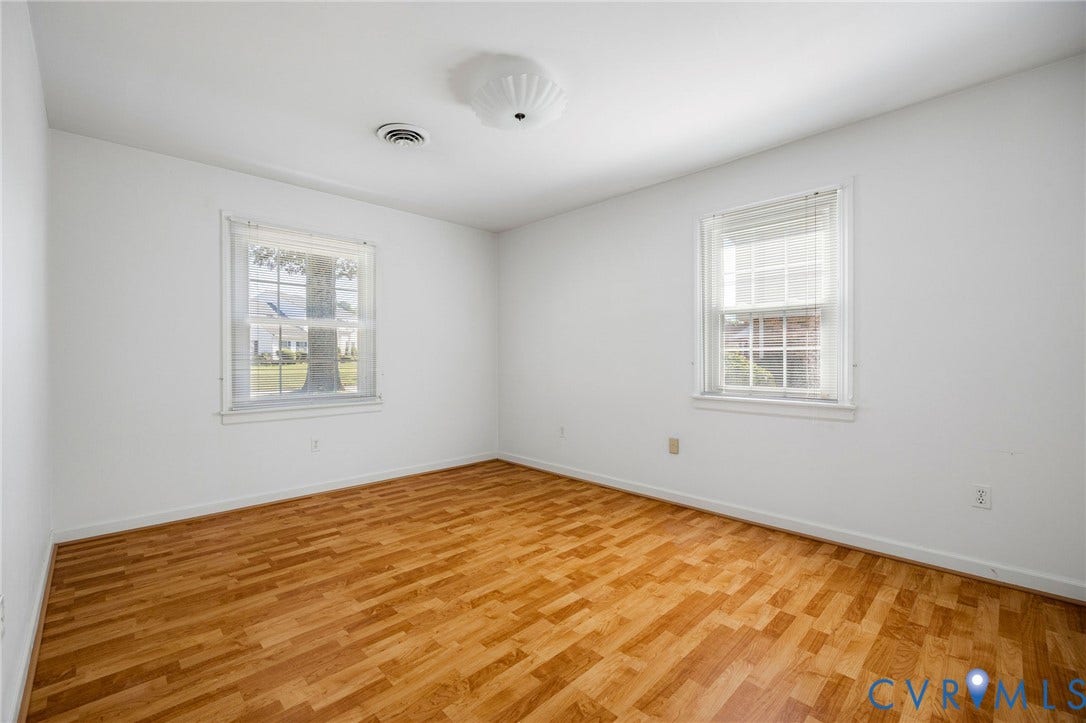 3356 Seaton Road, Petersburg, VA 23805 Bedroom 2: Wood-finish flooring, 2 windows. ceiling-mounted light fixture and closet.
