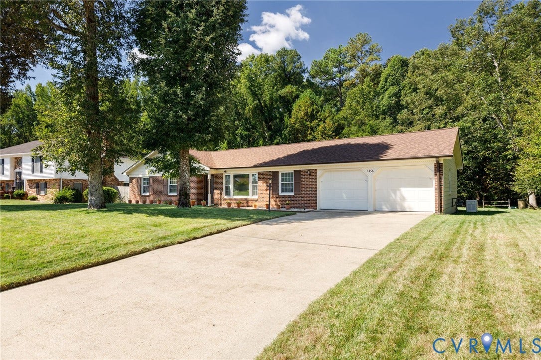 3356 Seaton Road, Petersburg, VA 23805 Brick exterior with a brown shingle roof, concrete driveway, and a two-car garage