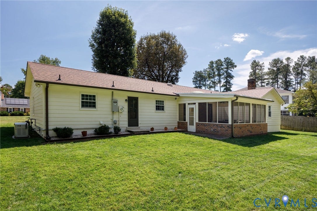 3356 Seaton Road, Petersburg, VA 23805 Expansive rear yard featuring a screened porch, brick half-wall detailing, and a shingle roof