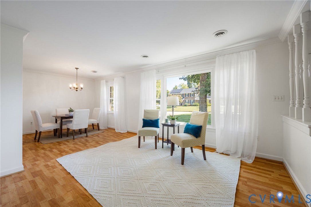 3356 Seaton Road, Petersburg, VA 23805 Wood-finish flooring throughout, featuring a dining area with a chandelier