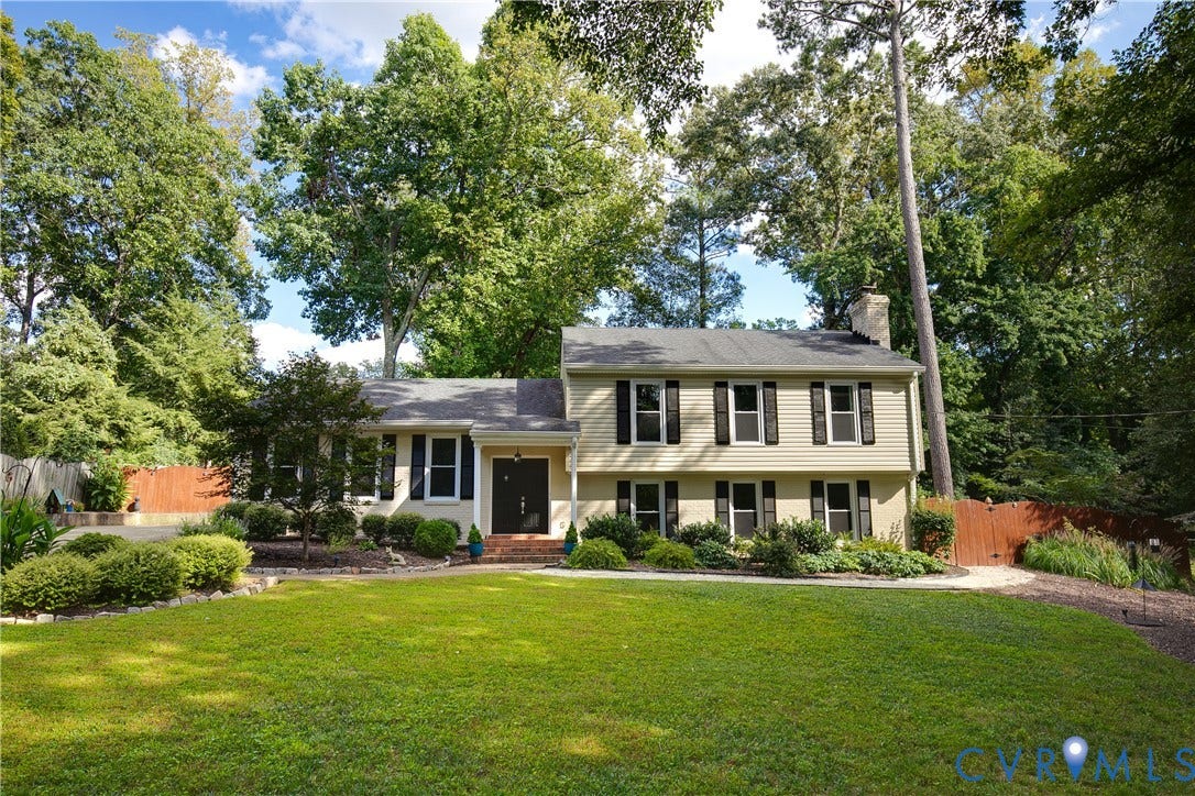 4327 Wakefield Road, Stratford Hills, Richmond, VA 23235 Two-story siding exterior with dark shutters, established landscaping, mature trees, and a front lawn