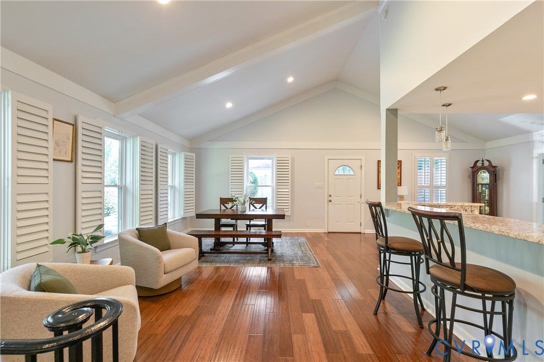 4327 Wakefield Road, Stratford Hills, Richmond, VA 23235 Vaulted ceilings with exposed beams, wood-finish flooring, plantation shutters, and a kitchen pass-through with a granite countertop
