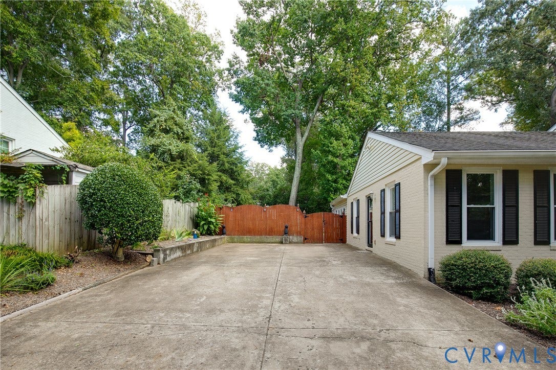 4327 Wakefield Road, Stratford Hills, Richmond, VA 23235 Paved driveway with a side-gabled roofline and light-colored brick exterior