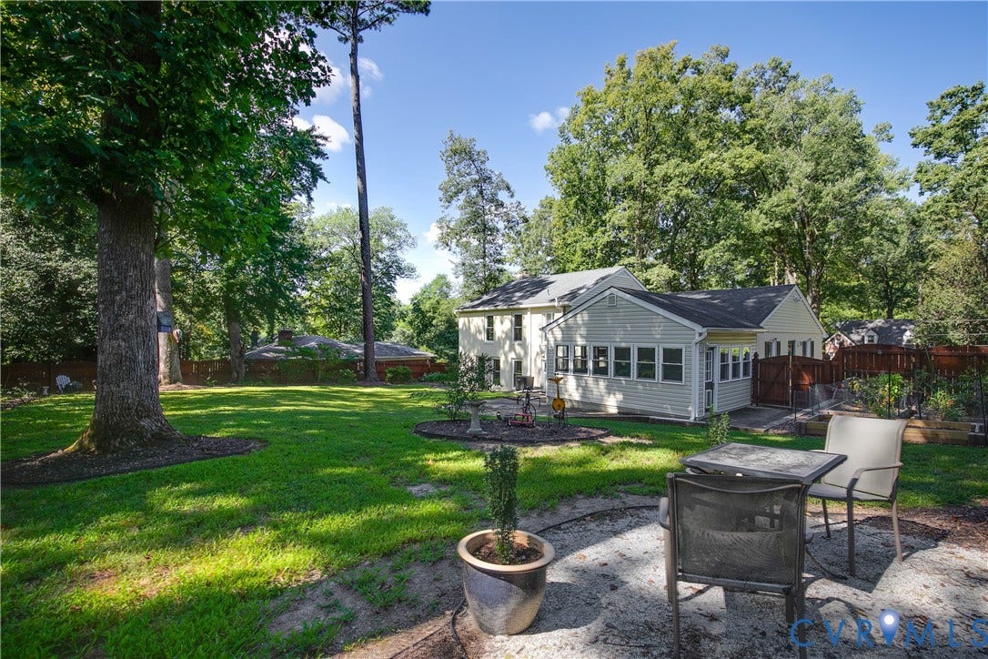 4327 Wakefield Road, Stratford Hills, Richmond, VA 23235 Expansive backyard featuring a manicured lawn, mature trees, and a stone patio