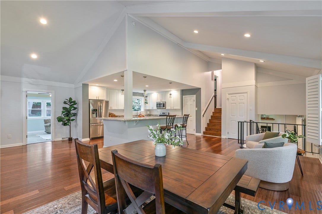 4327 Wakefield Road, Stratford Hills, Richmond, VA 23235 Vaulted ceilings with exposed beams, recessed lighting, wood-finish flooring, white cabinetry, and stainless steel appliances