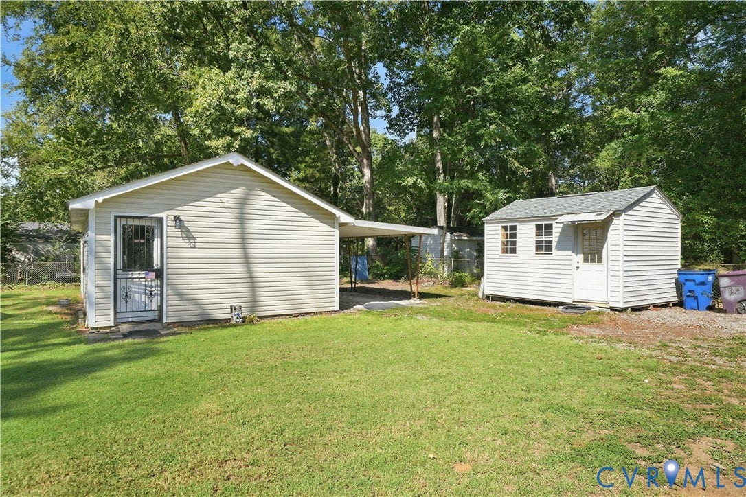 2406 McRae Road, Richmond, VA 23235 A detached workshop (on left) provides dedicated space for projects, tools, and equipment.