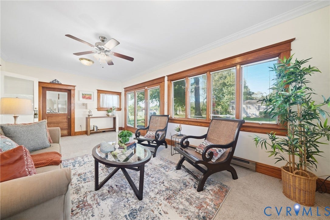 2406 McRae Road, Richmond, VA 23235 The sunroom offers a quiet connection to the surrounding natural setting
