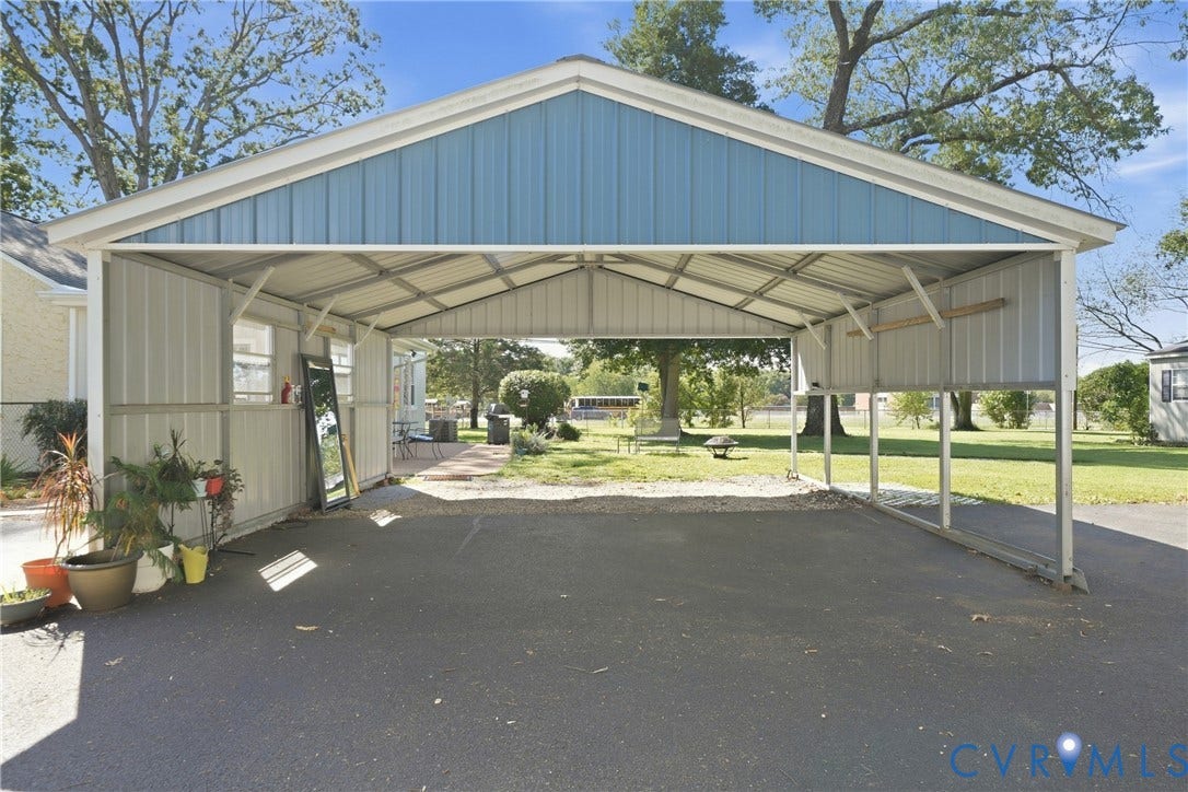 2406 McRae Road, Richmond, VA 23235 The metal two car carport offers convenient covered parking close to the home.
