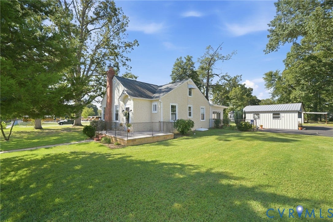 2406 McRae Road, Richmond, VA 23235 The expansive green lawn complimented by an oversize porch for sitting.
