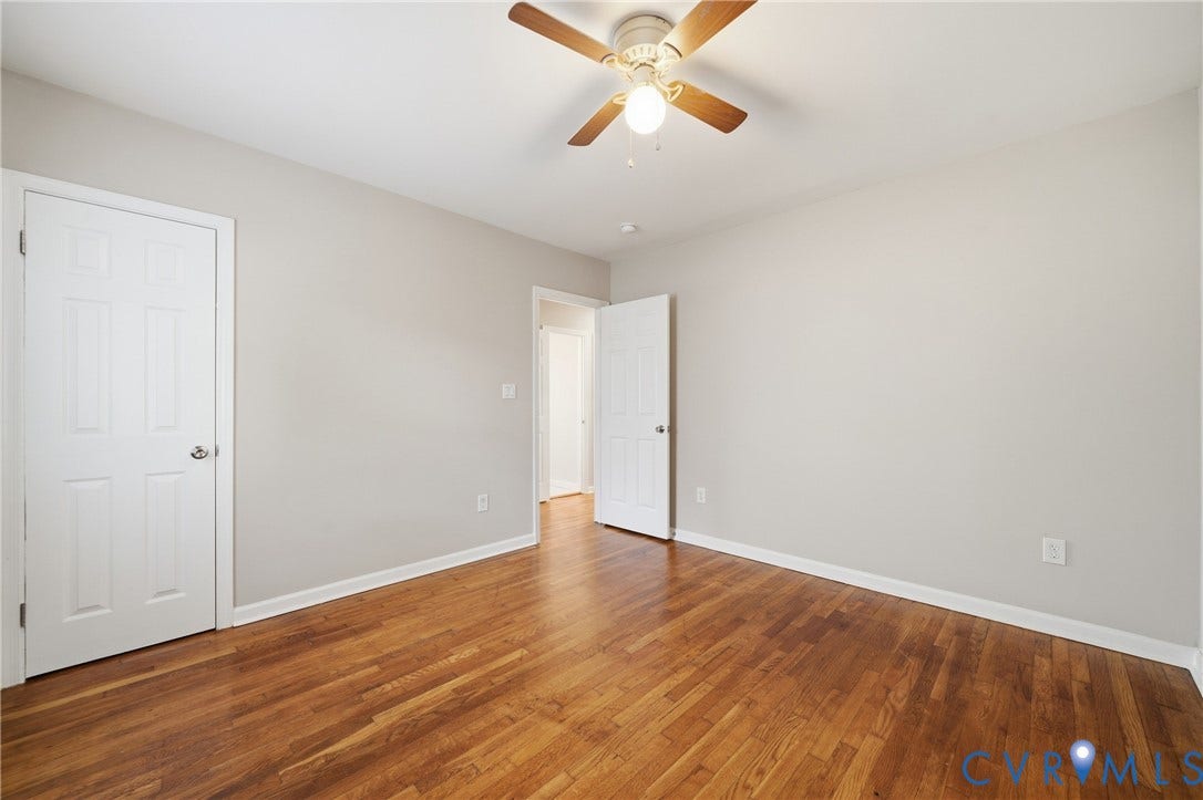1718 Rogers, Richmond, VA 23223 Wood-finish flooring, light gray wall paint, and a ceiling fan with integrated lighting