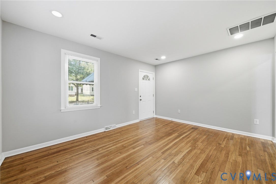 1718 Rogers, Richmond, VA 23223 Wood-finish flooring, recessed lighting, and a white entry door with an arched window