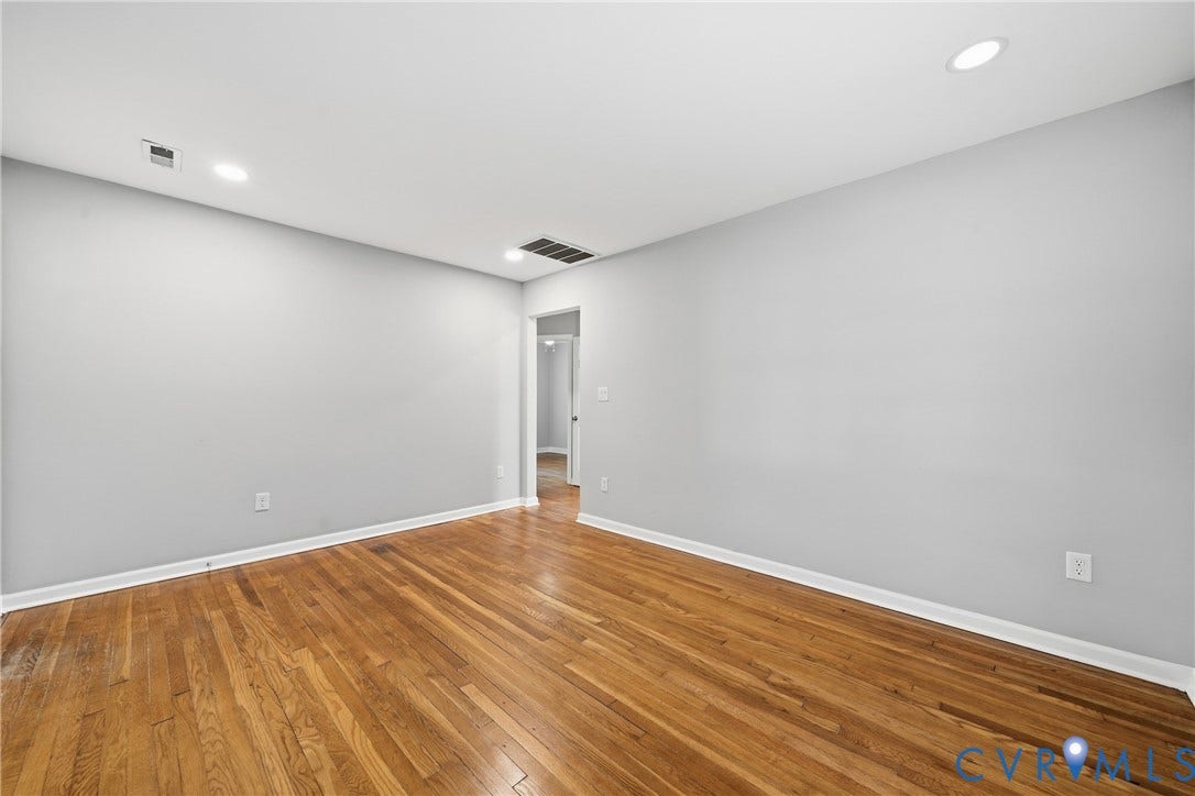1718 Rogers, Richmond, VA 23223 Wood-finish flooring, recessed lighting, neutral wall paint, and white trim