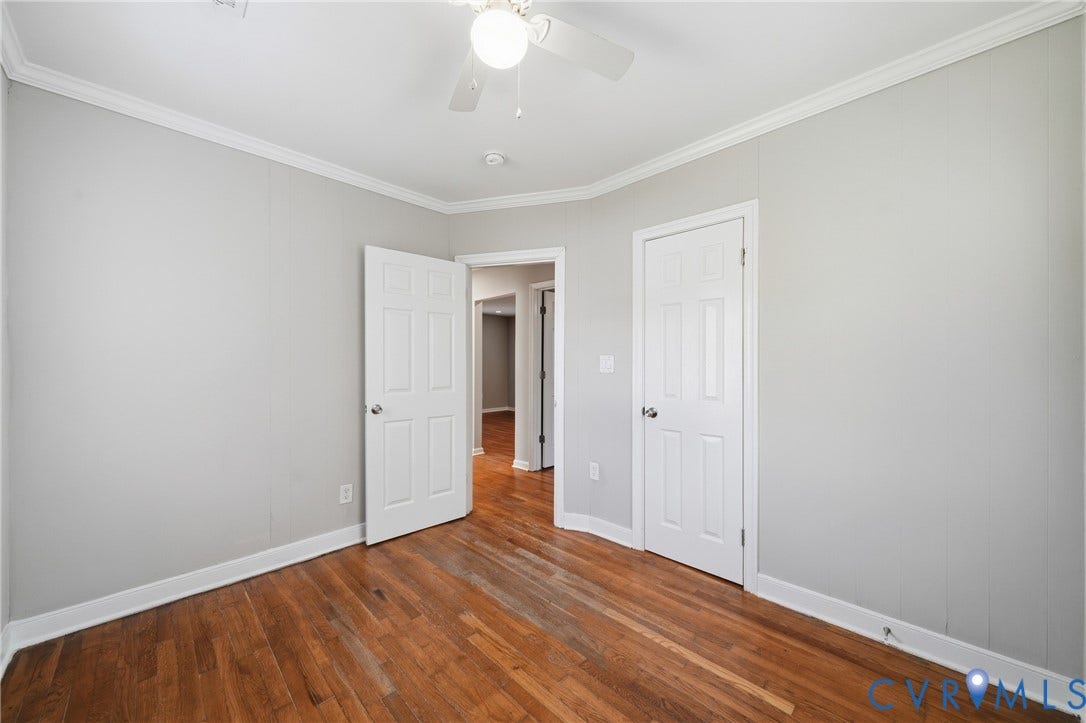 1718 Rogers, Richmond, VA 23223 Hardwood flooring, painted walls, ceiling fan, crown molding, and paneled doors