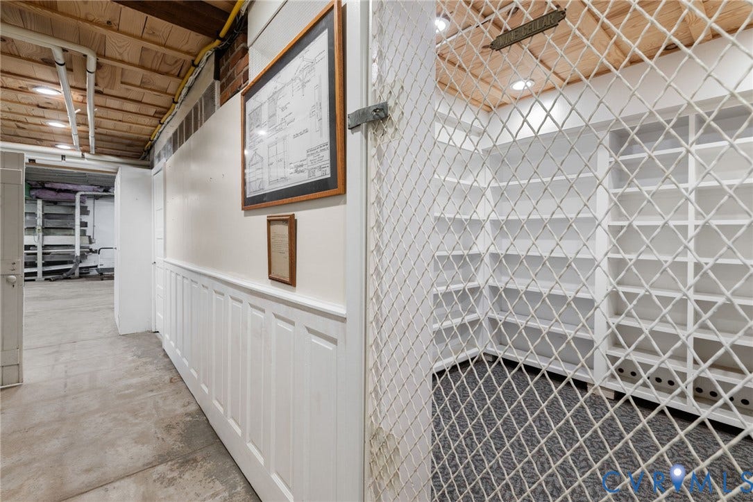 Built-in shelving, concrete flooring, and wainscoting detail